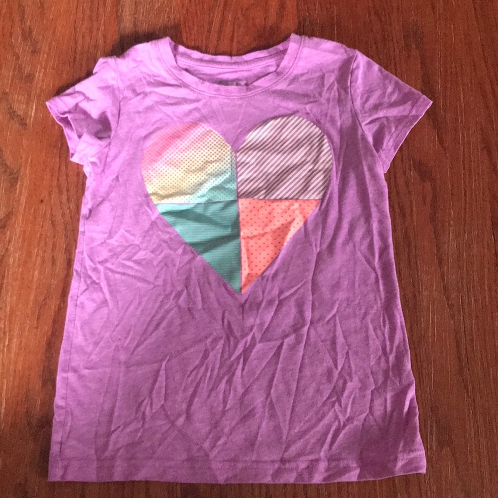 Purple short sleeve shirt.